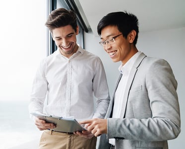 Coworkers reviewing a document on a tablet