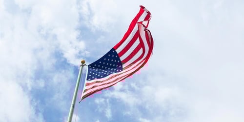 The American flag blows in the wind