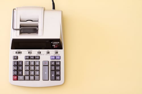 A calculator sits on top of a table