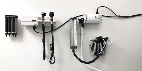 Medical equipment mounted on a wall. 
