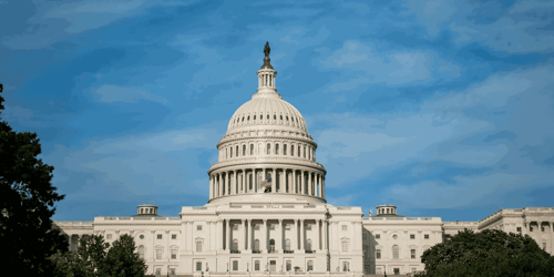 The United States capitol building on a sunny day.