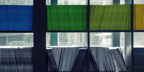 A shelf of neatly organized files. 