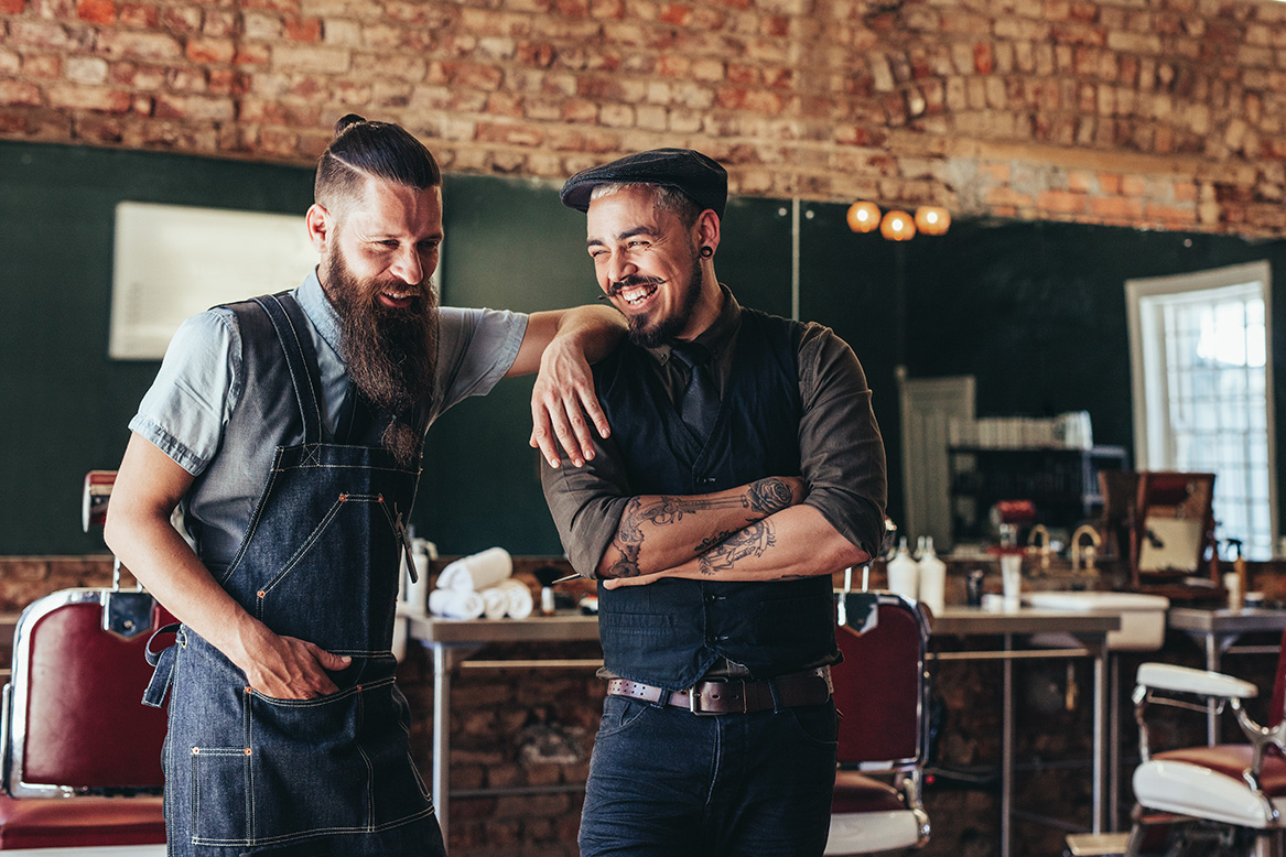 Barbershop owners enjoying a laugh