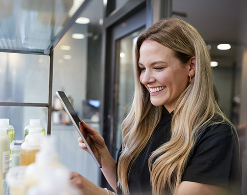 Salon shop owner reviewing inventory