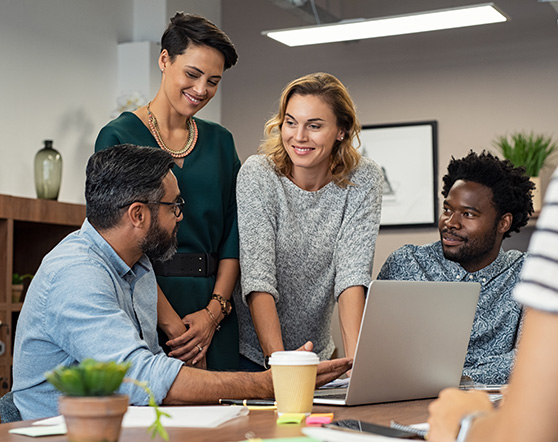 A startup company huddle at a conference table