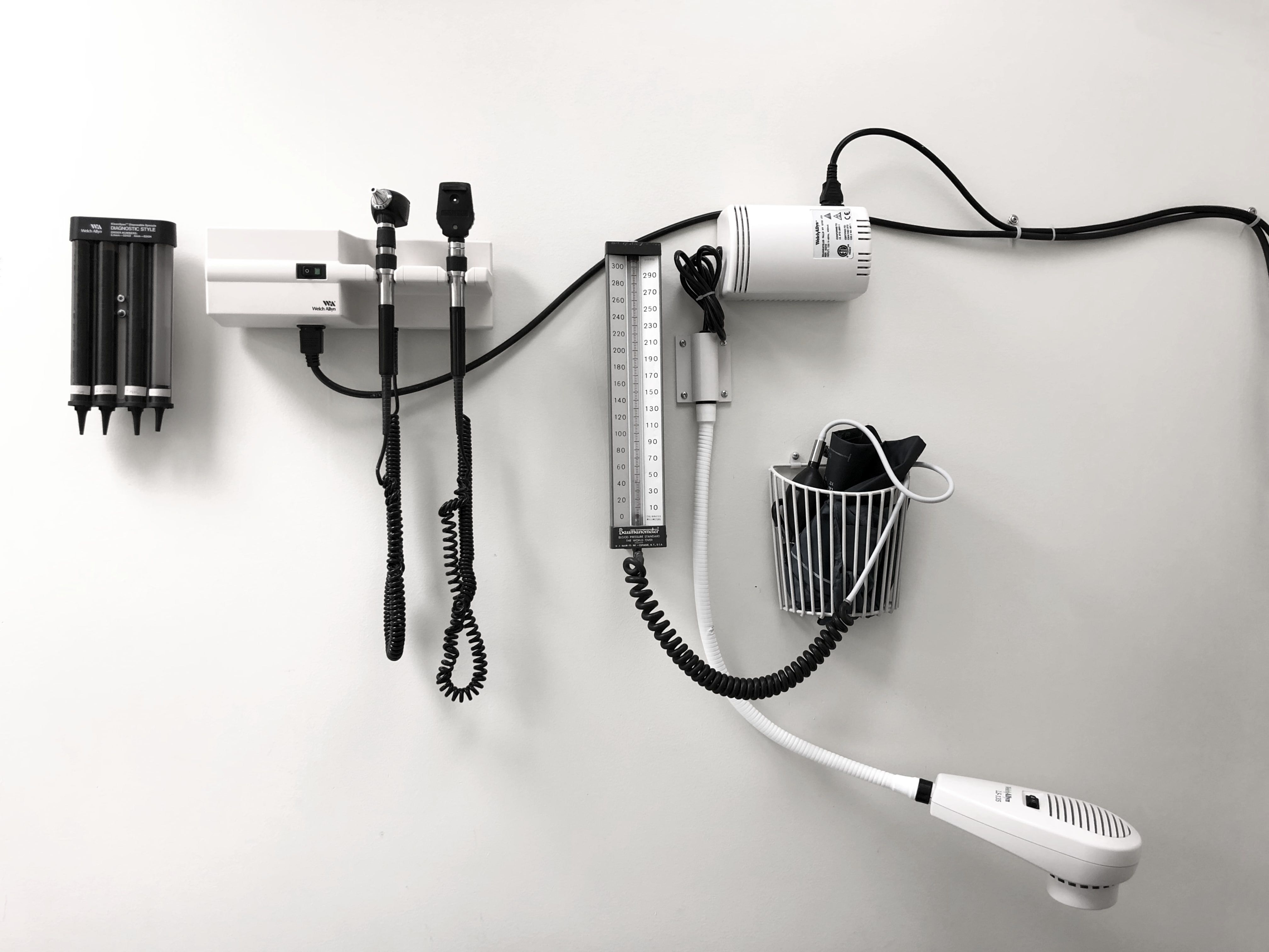 Medical equipment is mounted to the doctor's office wall