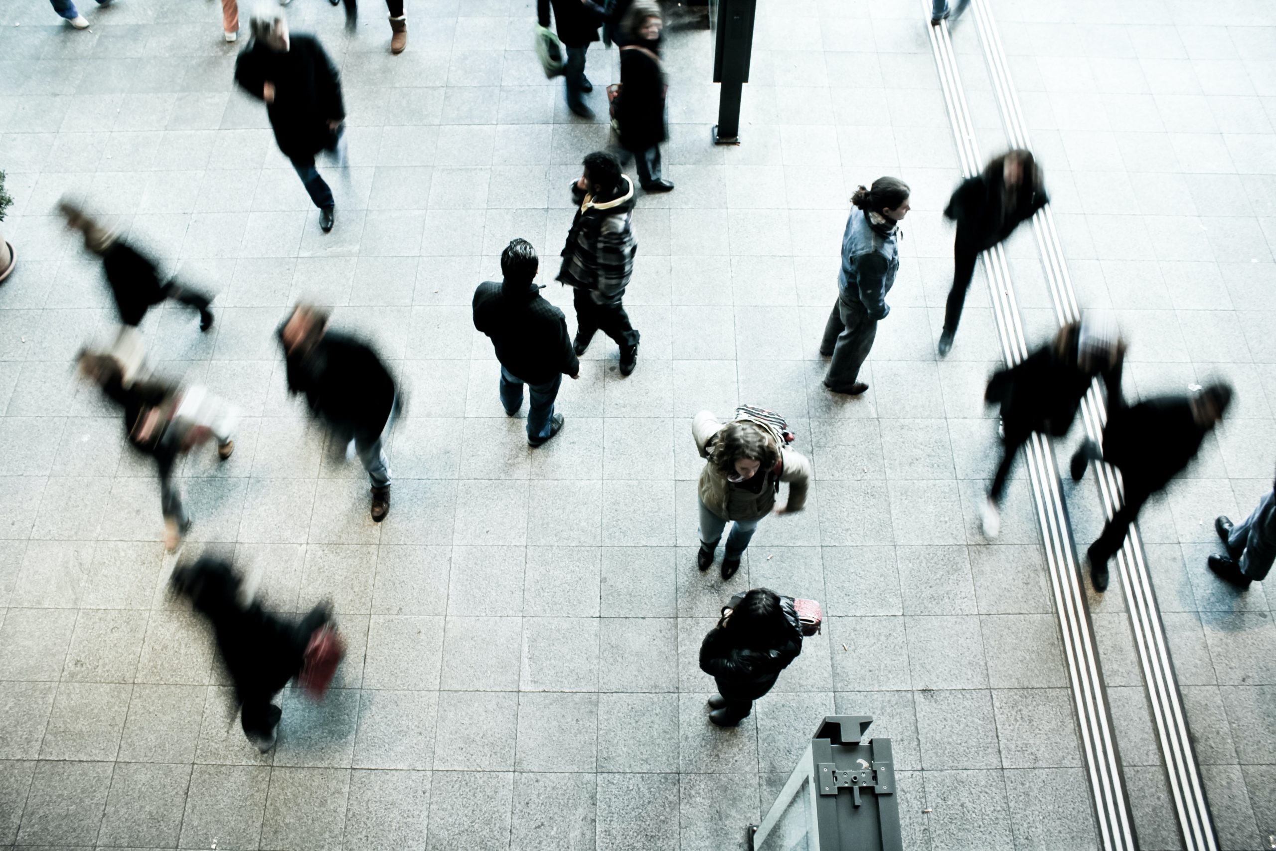 People walk through a crowded area