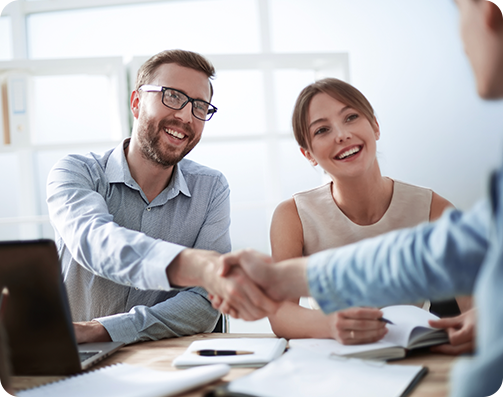 People shaking hands and smiling