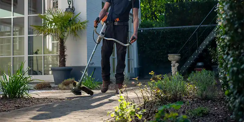 Landscaper clearing an entryway. 
