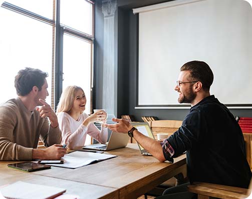 A group of people in a meeting